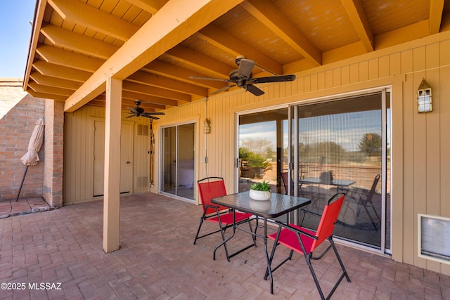 view of patio with outdoor dining area and ceiling fan