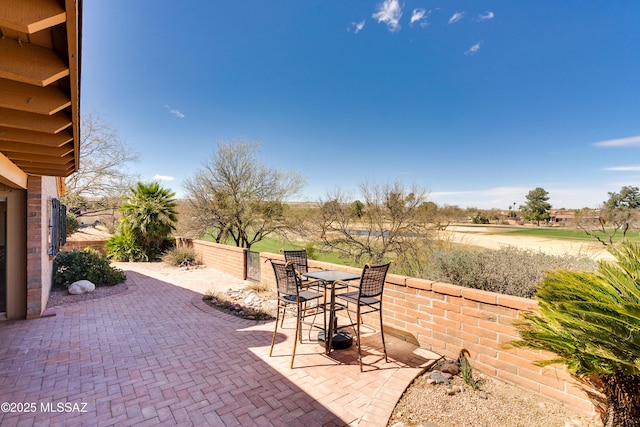 view of patio / terrace with outdoor dining space and fence