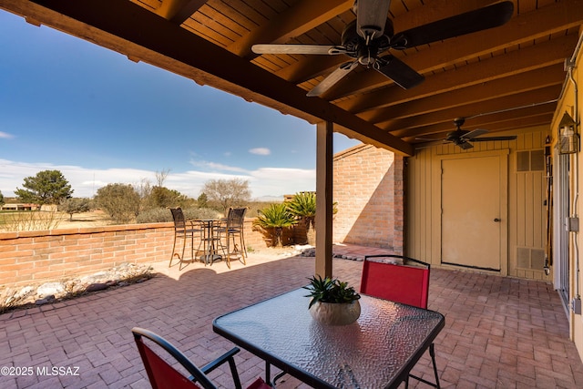 view of patio / terrace with outdoor dining space and a ceiling fan