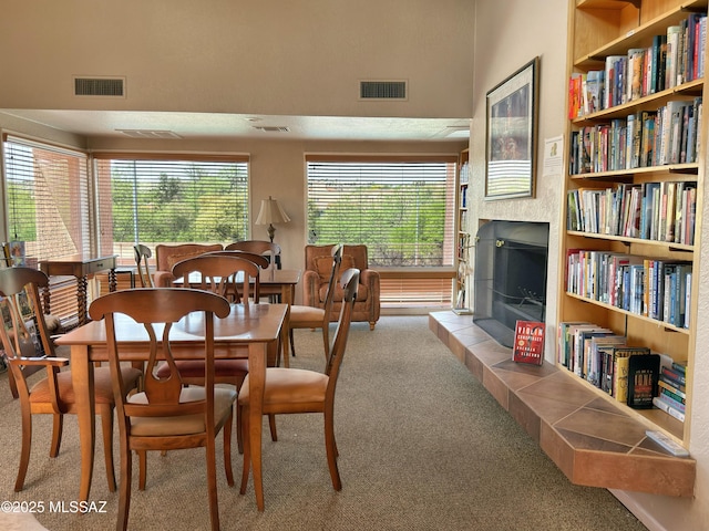 5051 N Sabino Canyon Rd Unit 1152, Tucson, AZ 85750 - dining room with carpet flooring, a fireplace, and built in shelves