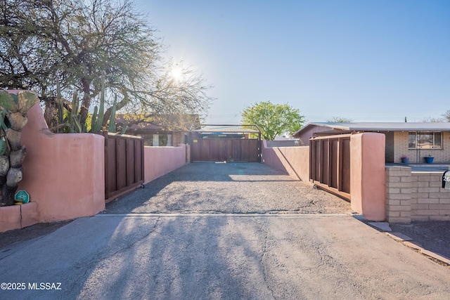 exterior space with a gated entry, driveway, and a gate