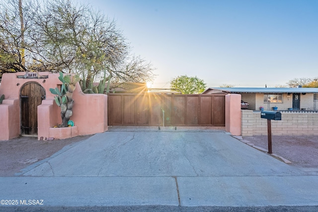 view of gate featuring a fenced front yard