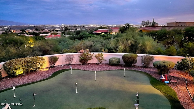 view of home's community featuring fence