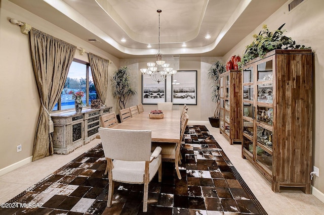 dining area with visible vents, baseboards, recessed lighting, an inviting chandelier, and a raised ceiling
