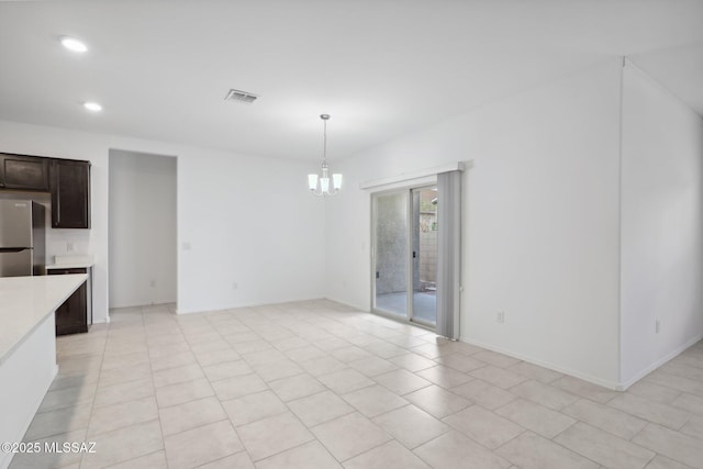 unfurnished dining area featuring a chandelier, light tile patterned floors, baseboards, visible vents, and recessed lighting