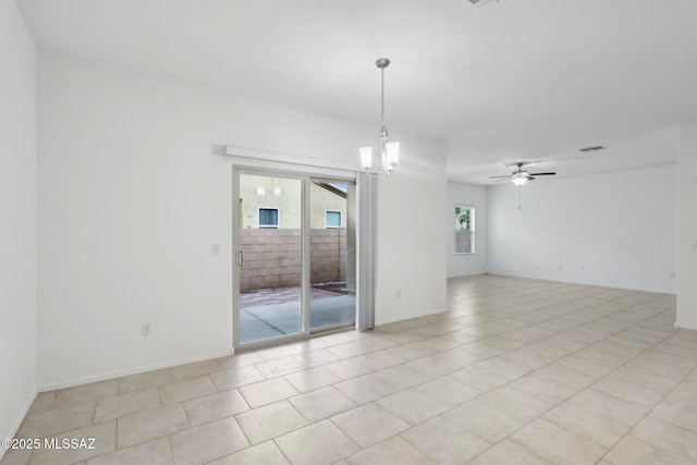 empty room with a ceiling fan, light tile patterned floors, and visible vents