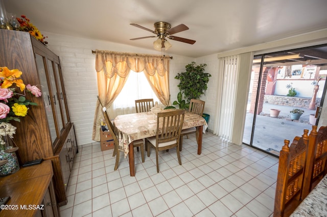 dining room with light tile patterned flooring and a ceiling fan