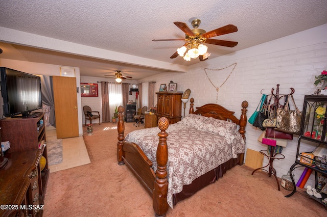 bedroom with light carpet, brick wall, and a textured ceiling