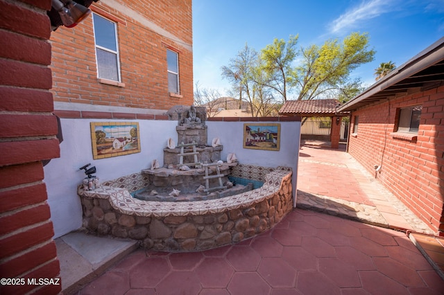 view of patio featuring fence