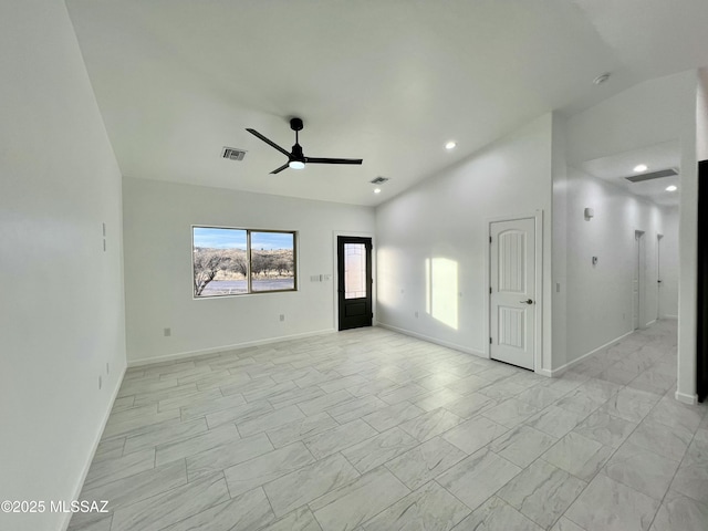 spare room with visible vents, baseboards, ceiling fan, lofted ceiling, and marble finish floor