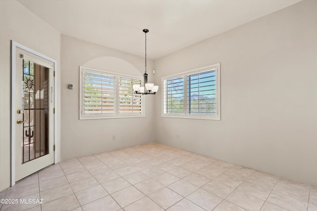 empty room with a notable chandelier