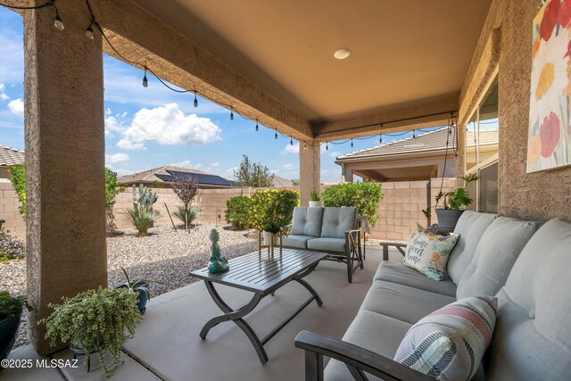 8874 W Saguaro Skies Rd, Marana, AZ 85653 - view of patio with an outdoor living space and a fenced backyard