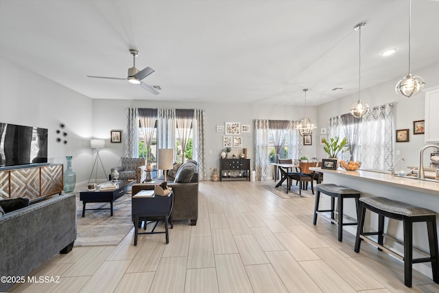 8874 W Saguaro Skies Rd, Marana, AZ 85653 - living room with a chandelier and a ceiling fan