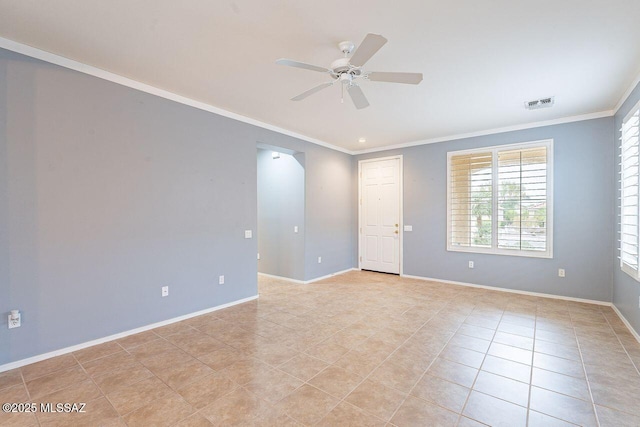empty room featuring crown molding, light tile patterned flooring, a ceiling fan, and baseboards