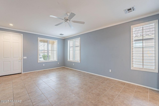 spare room with visible vents, baseboards, crown molding, and a ceiling fan