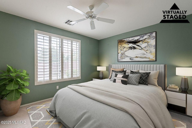 carpeted bedroom with visible vents, ceiling fan, and baseboards