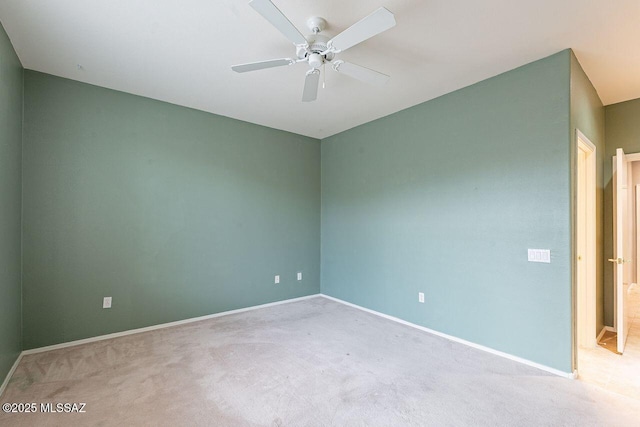 unfurnished room featuring baseboards, carpet, and ceiling fan