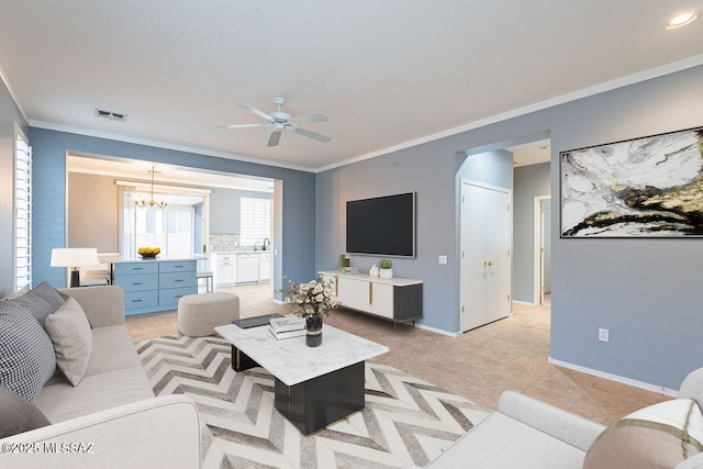 living room featuring visible vents, baseboards, ornamental molding, light tile patterned floors, and ceiling fan with notable chandelier