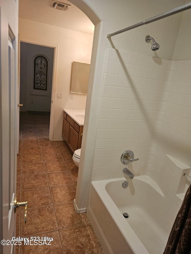 full bath with vanity, toilet, tile patterned floors, visible vents, and shower / tub combination