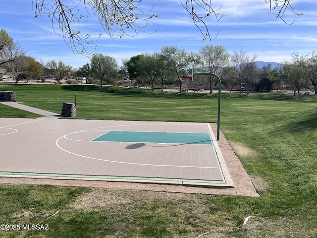 view of sport court featuring a mountain view, a yard, and community basketball court