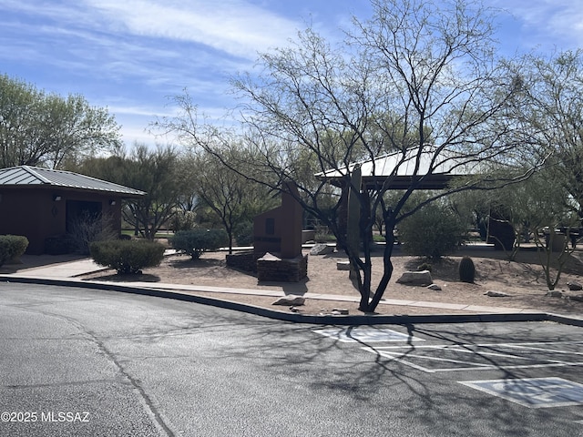 view of road with sidewalks and curbs