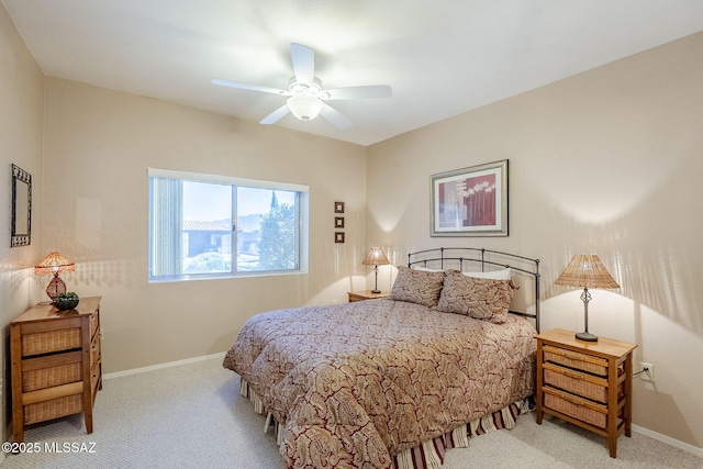 carpeted bedroom featuring a ceiling fan and baseboards