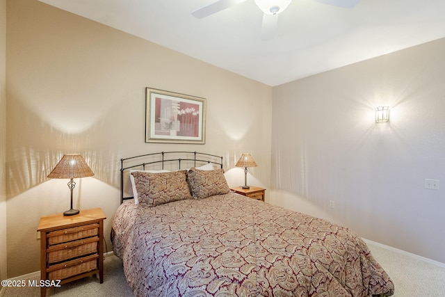 carpeted bedroom with baseboards and ceiling fan