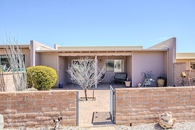 exterior space with a fenced front yard