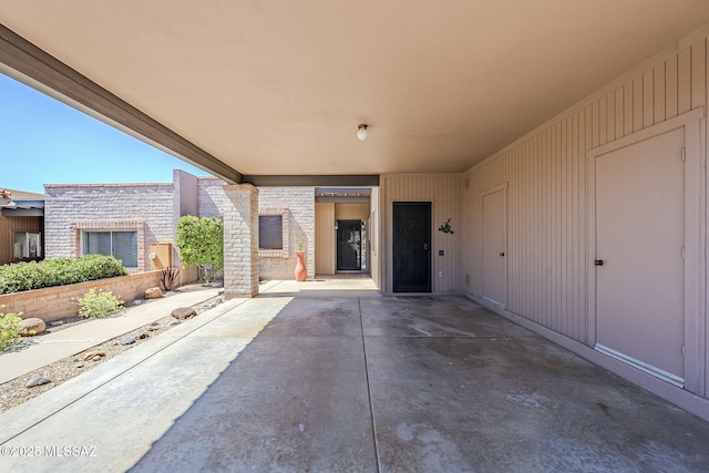 view of patio / terrace featuring a carport