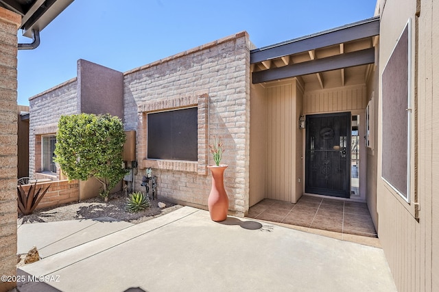 doorway to property with a patio area