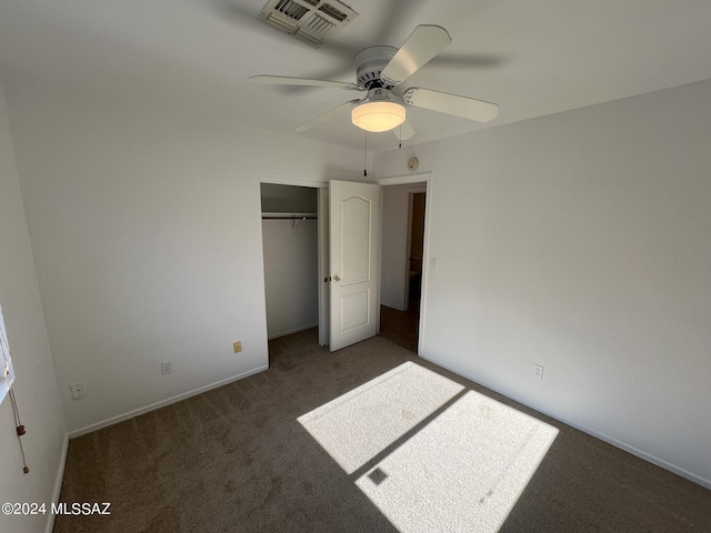 unfurnished bedroom featuring baseboards, visible vents, ceiling fan, a closet, and carpet flooring
