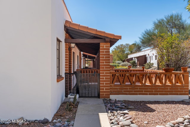 207 S Paseo Tierra Unit A, Green Valley, AZ 85614 - view of exterior entry featuring stucco siding