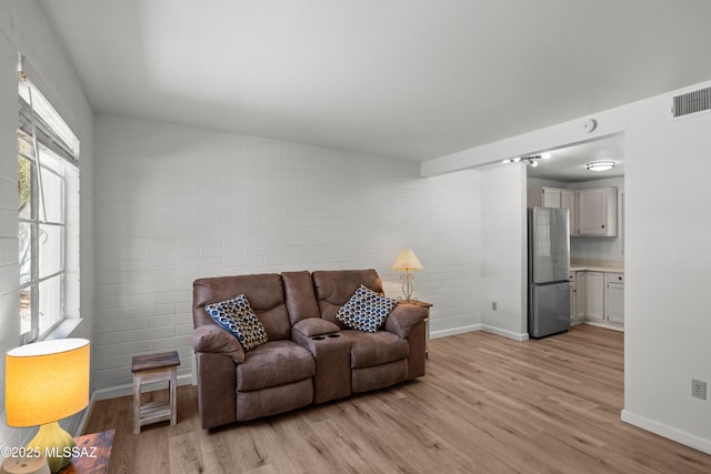 207 S Paseo Tierra Unit A, Green Valley, AZ 85614 - living area with light wood-style floors and baseboards