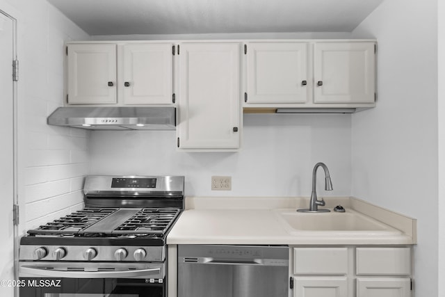 207 S Paseo Tierra Unit A, Green Valley, AZ 85614 - kitchen featuring stainless steel appliances, under cabinet range hood, a sink, and white cabinetry