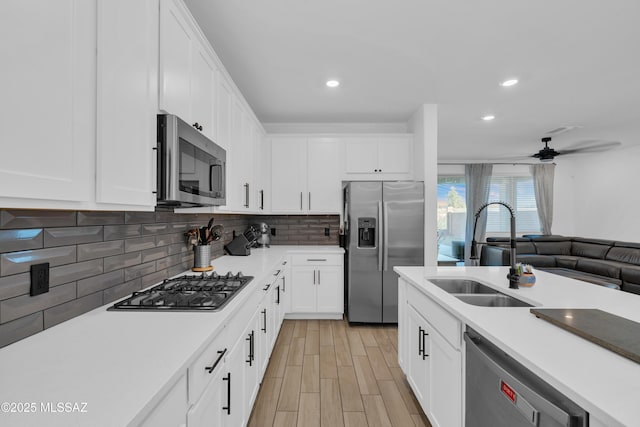 8111 S Soltero Mine Dr, Tucson, AZ 85747 - kitchen featuring stainless steel appliances, light countertops, a ceiling fan, white cabinets, and recessed lighting