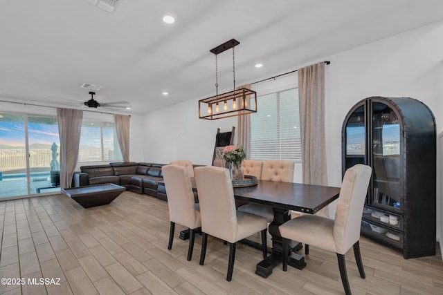 8111 S Soltero Mine Dr, Tucson, AZ 85747 - dining room featuring light wood-type flooring, recessed lighting, and a ceiling fan