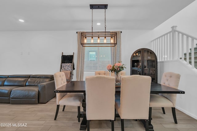 8111 S Soltero Mine Dr, Tucson, AZ 85747 - dining space with stairway, wood finished floors, and recessed lighting