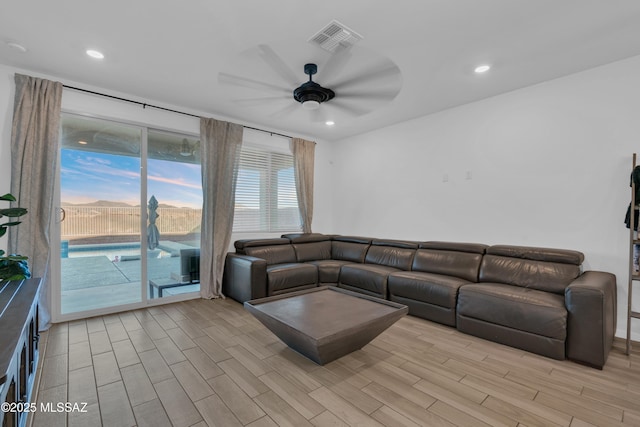 8111 S Soltero Mine Dr, Tucson, AZ 85747 - living room with a ceiling fan, light wood finished floors, and recessed lighting