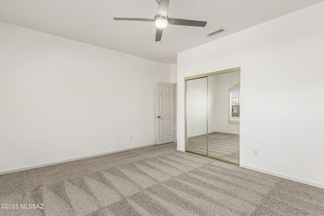 unfurnished bedroom with a ceiling fan, baseboards, visible vents, a closet, and carpet flooring