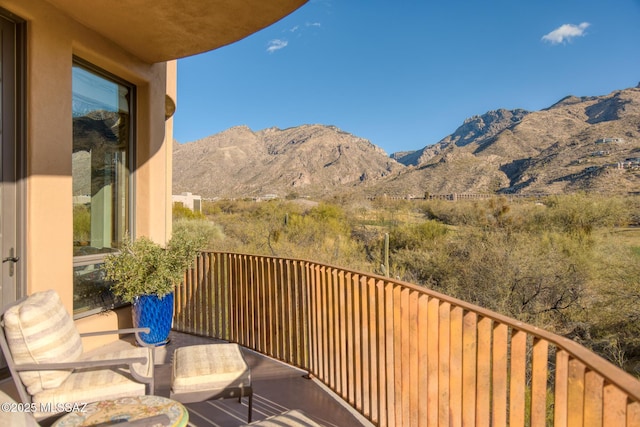 balcony featuring a mountain view
