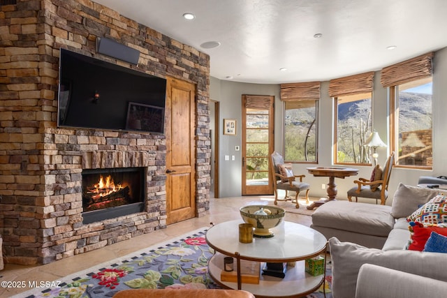 living area featuring a fireplace and recessed lighting