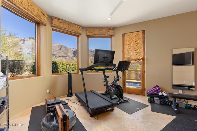 exercise area featuring a ceiling fan