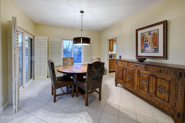 dining room with plenty of natural light and light tile patterned flooring