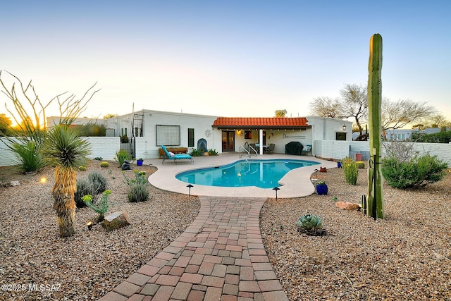 view of pool featuring a fenced backyard, a patio, and a fenced in pool