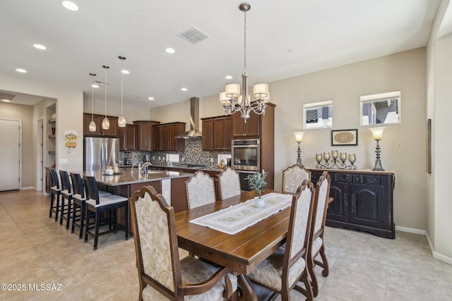 dining room featuring visible vents, baseboards, light tile patterned floors, an inviting chandelier, and recessed lighting