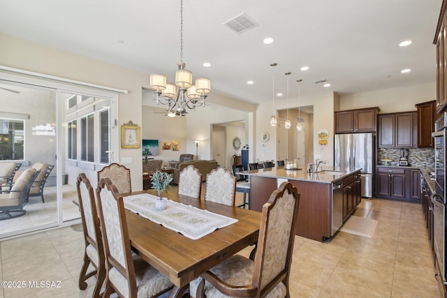 dining area with visible vents, recessed lighting, a chandelier, and light tile patterned floors