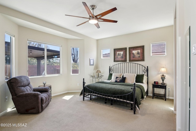 bedroom with baseboards, a ceiling fan, and carpet