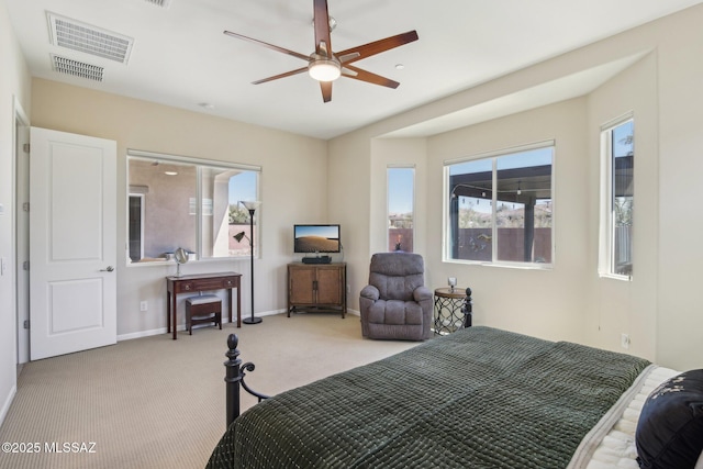 bedroom featuring visible vents, baseboards, a ceiling fan, and light colored carpet