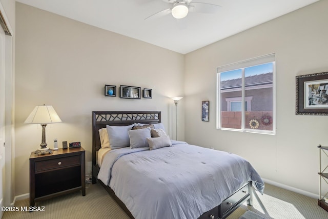 carpeted bedroom with baseboards and ceiling fan