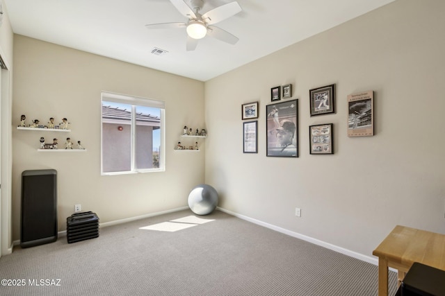 misc room with visible vents, ceiling fan, baseboards, and carpet floors